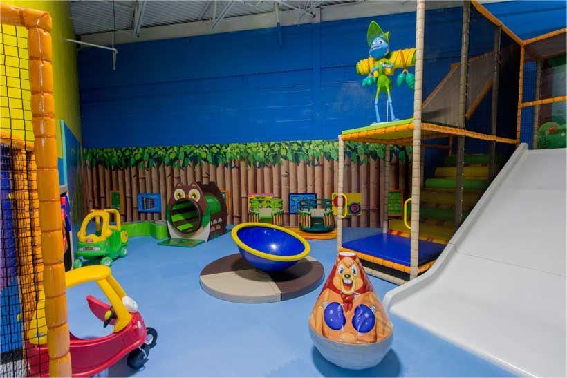Soft-play toddler jungle zone with a slide